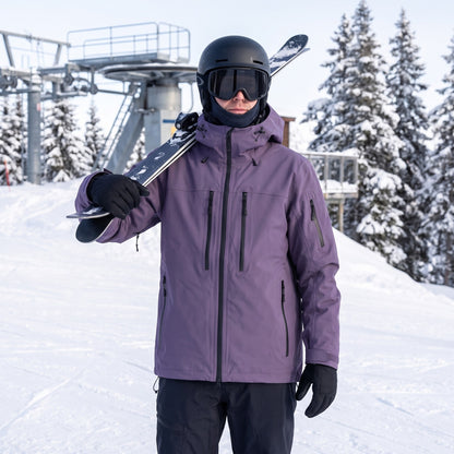 Vinterjakke Unisex – med ski på skulderen ved liften
